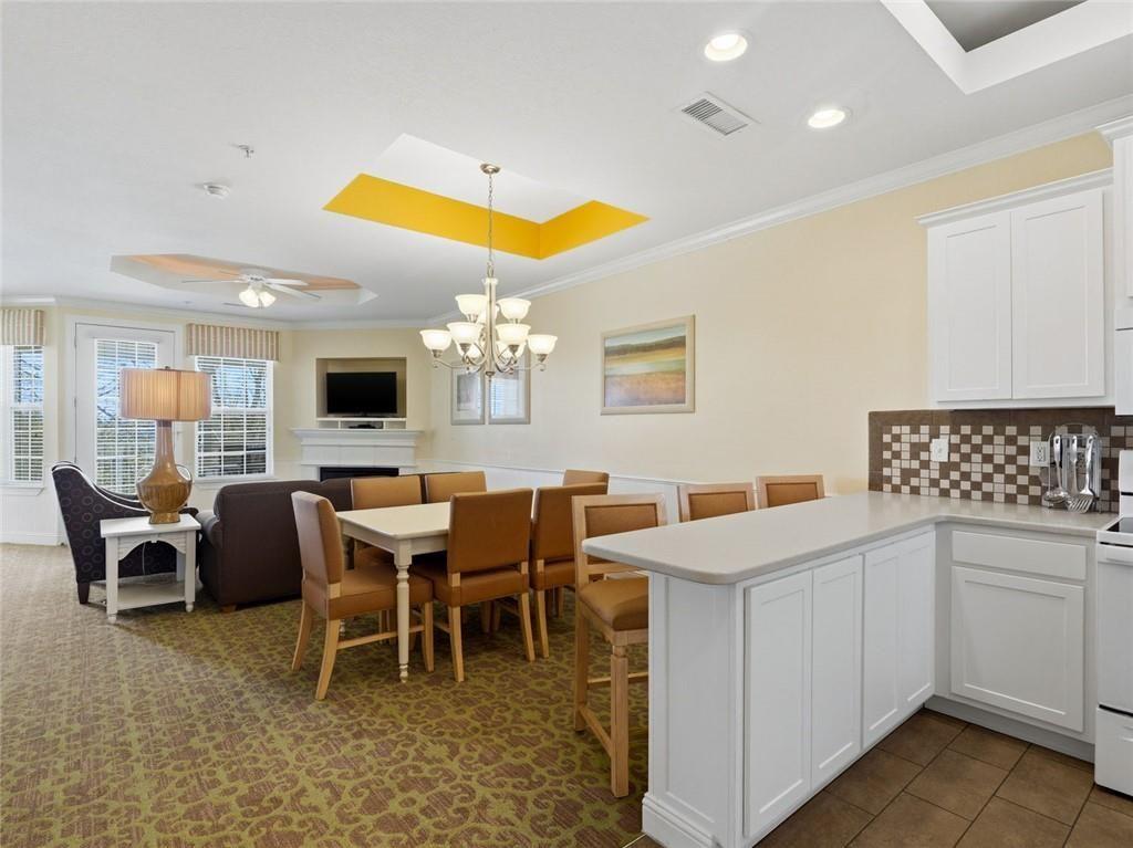 150 Apple Seed Court, Unit 131 Clarkesville, GA 30523 - Photo 1 of 40 a view of a dining room with furniture and chandelier