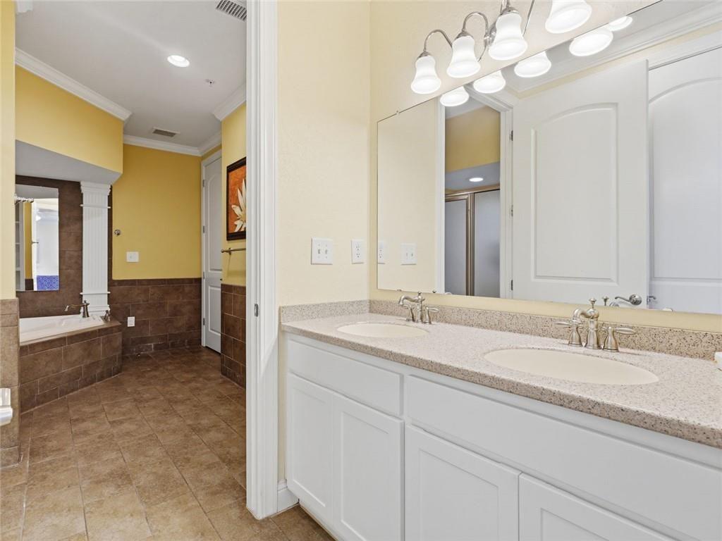 150 Apple Seed Court, Unit 131 Clarkesville, GA 30523 - Photo 12 of 40 a spacious bathroom with a granite countertop sink a light fixture and a mirror