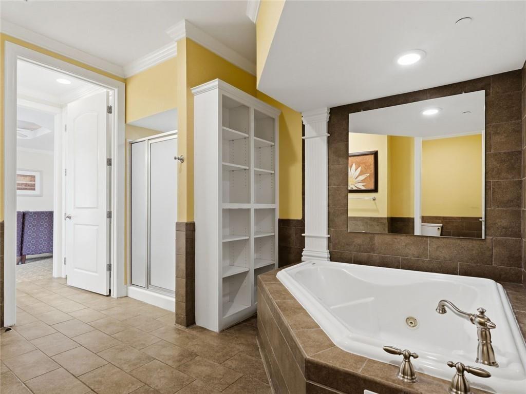 150 Apple Seed Court, Unit 131 Clarkesville, GA 30523 - Photo 16 of 40 a bathroom with a bathtub and a sink
