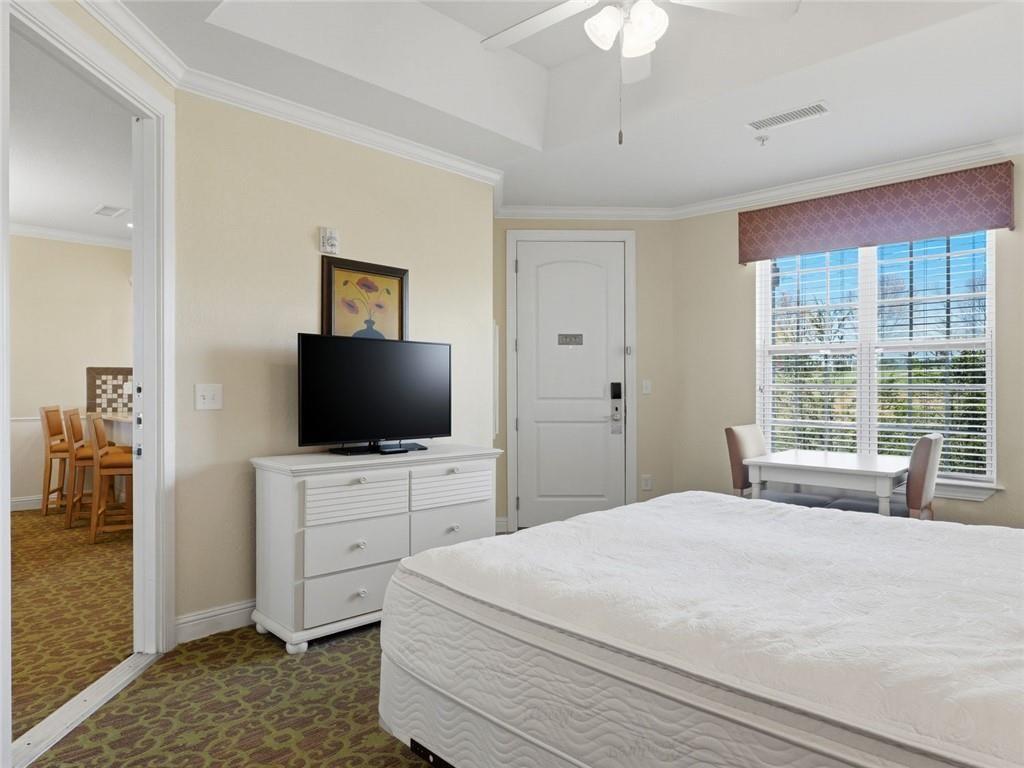 150 Apple Seed Court, Unit 131 Clarkesville, GA 30523 - Photo 19 of 40 a bedroom with a bed and a flat screen tv