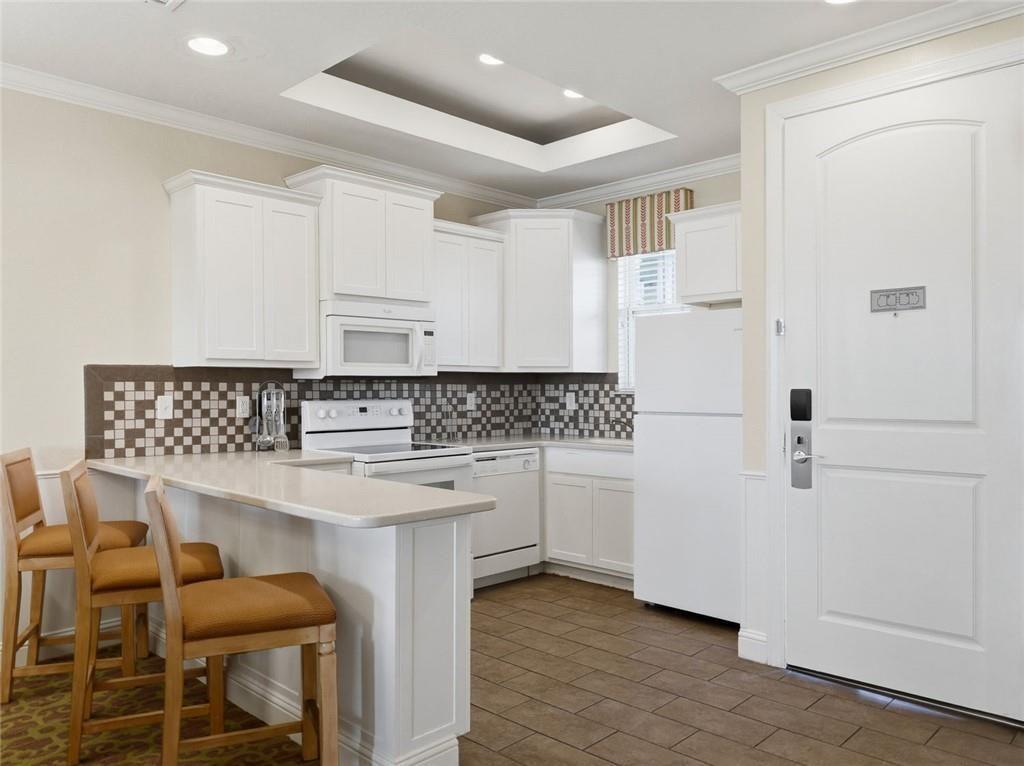 150 Apple Seed Court, Unit 131 Clarkesville, GA 30523 - Photo 26 of 40 a kitchen with stainless steel appliances white cabinets and wooden floor