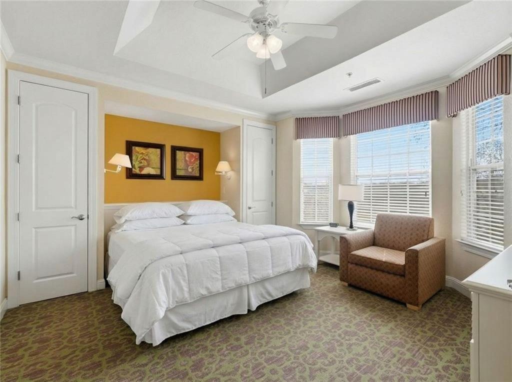 150 Apple Seed Court, Unit 131 Clarkesville, GA 30523 - Photo 28 of 40 a bedroom with a bed couch and window