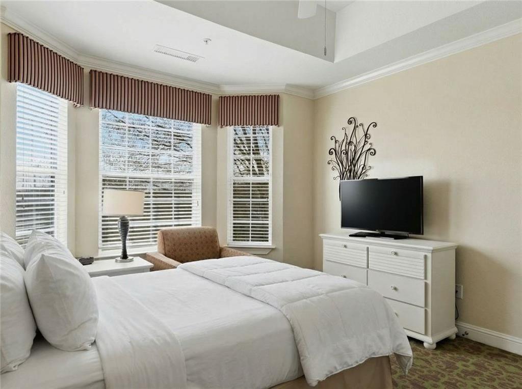 150 Apple Seed Court, Unit 131 Clarkesville, GA 30523 - Photo 30 of 40 a bedroom with a bed and tv