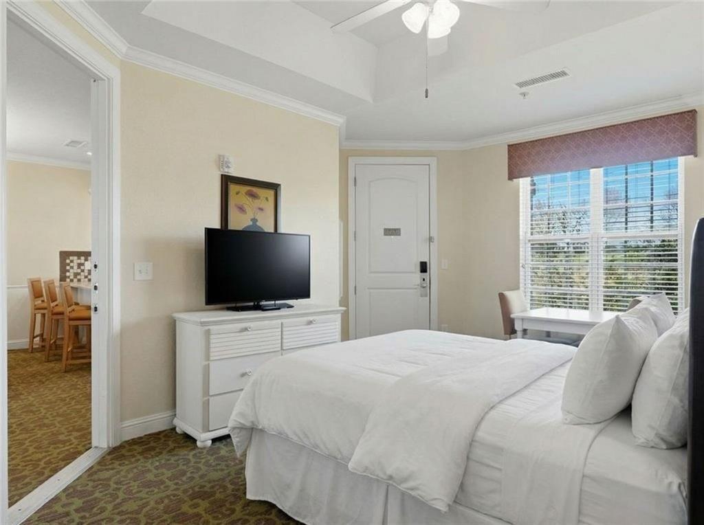 150 Apple Seed Court, Unit 131 Clarkesville, GA 30523 - Photo 33 of 40 a bedroom with a bed and a flat screen tv