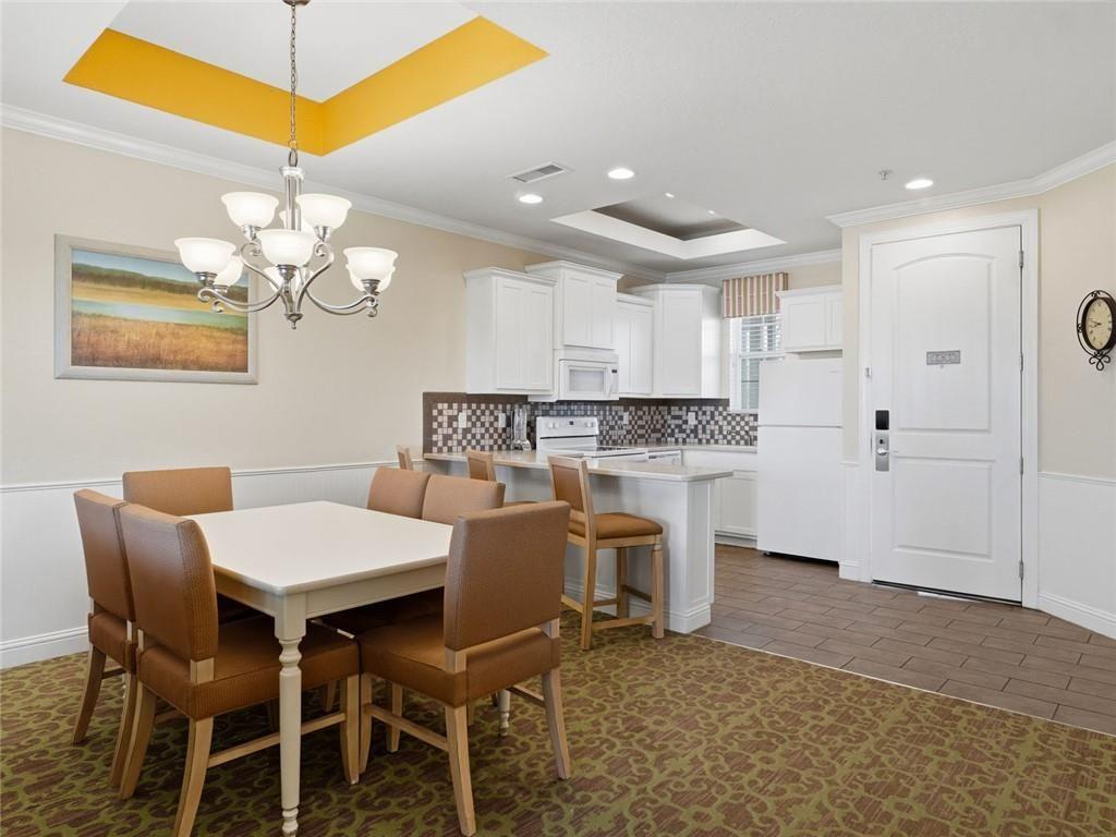 150 Apple Seed Court, Unit 131 Clarkesville, GA 30523 - Photo 5 of 40 a view of a dining room with furniture and chandelier