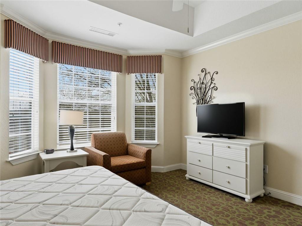 150 Apple Seed Court, Unit 131 Clarkesville, GA 30523 - Photo 10 of 40 a bedroom with furniture and flat screen tv