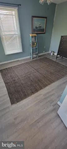 a view of a livingroom with wooden floor