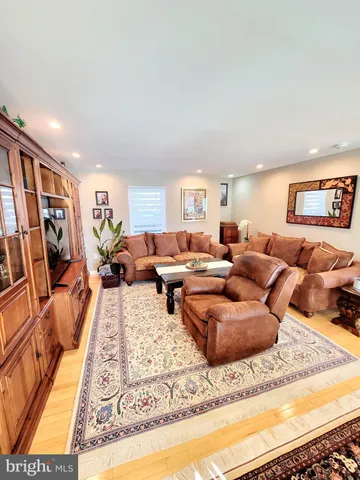 a living room with furniture and a rug