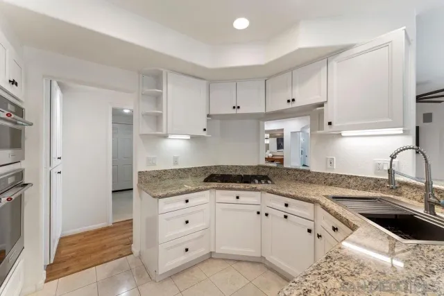 a bedroom with a large bed and a large window