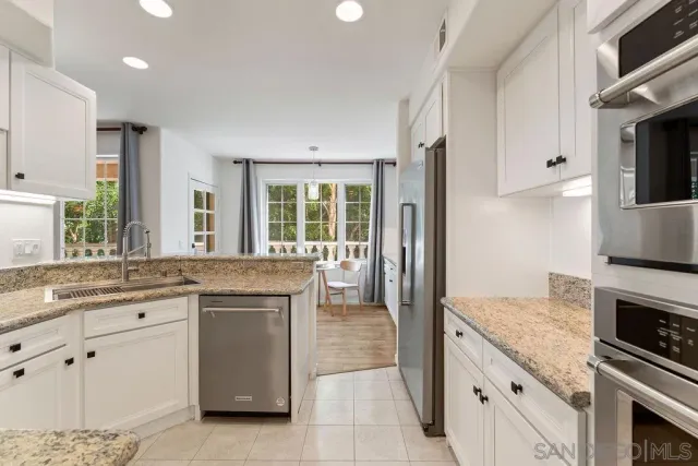 a bathroom with a toilet sink and shower