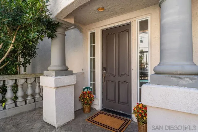 a view of a hallway with a livingroom and living room