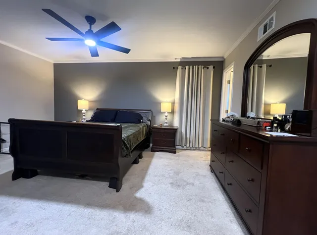 a bed room with a bed and a television