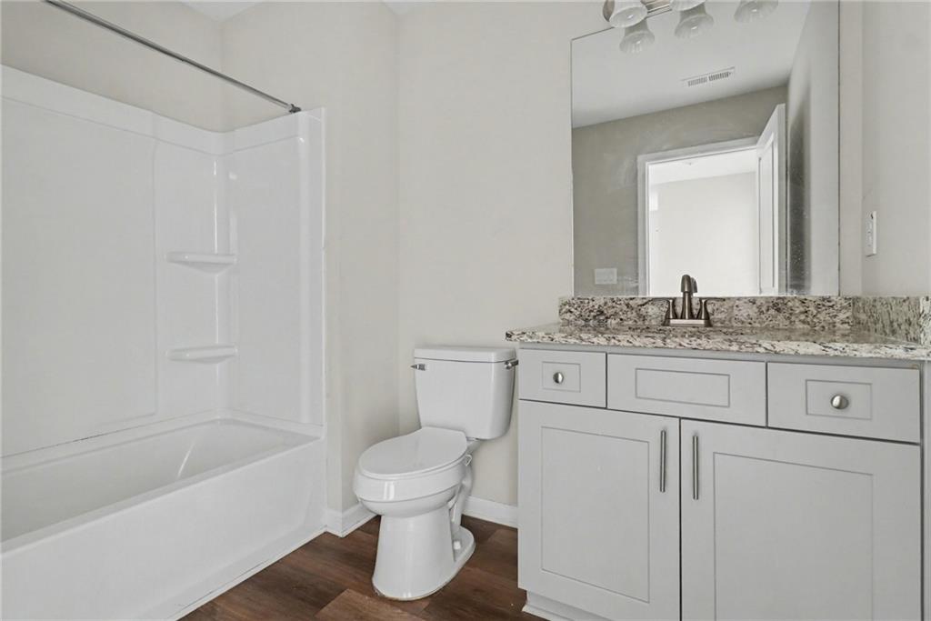 3352 Mt Zion Road Stockbridge, GA 30281 - Photo 16 of 22 a bathroom with a sink and a mirror