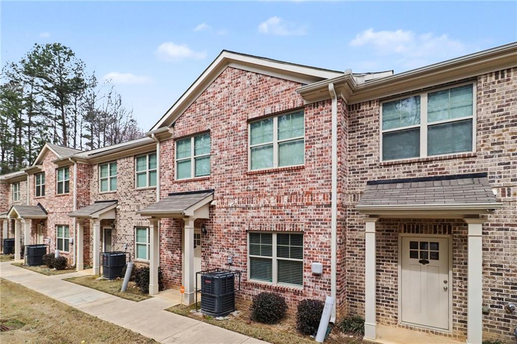 3352 Mt Zion Road Stockbridge, GA 30281 - Photo 3 of 22 a front view of a house with glass windows