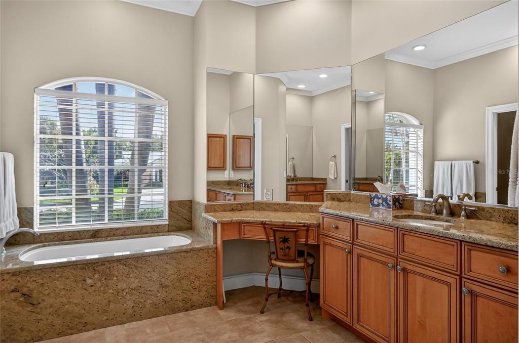 404 Partridge Circle Sarasota, FL 34236 - Photo 18 of 33 a spacious bathroom with sinks mirror and a bathtub