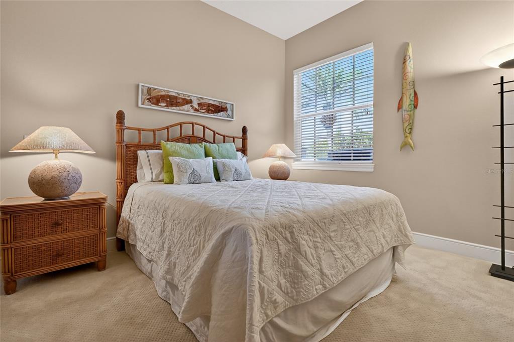 404 Partridge Circle Sarasota, FL 34236 - Photo 20 of 33 a bedroom with a bed and window