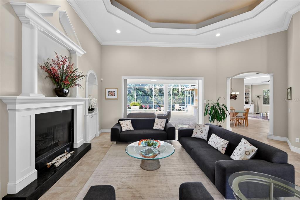 404 Partridge Circle Sarasota, FL 34236 - Photo 6 of 33 a living room with furniture and a fireplace