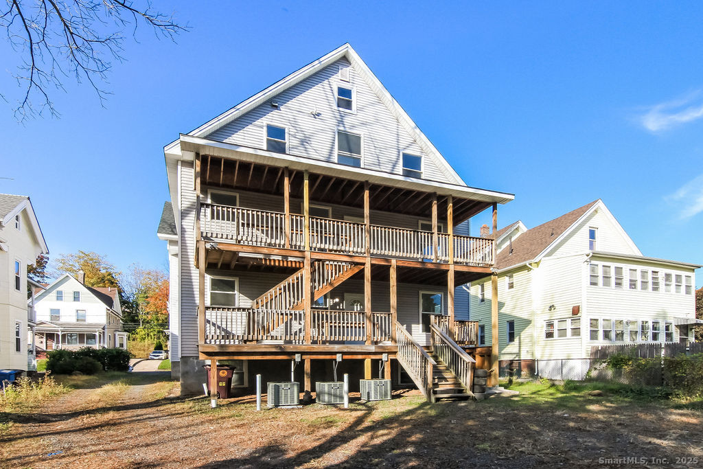 66 Winthrop Street, Unit 3 New Britain, CT 06052 - Photo 2 of 7 a front view of a house with a porch