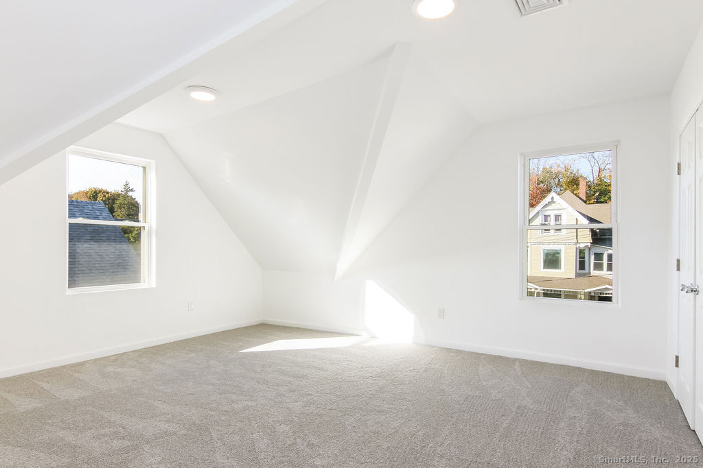66 Winthrop Street, Unit 3 New Britain, CT 06052 - Photo 6 of 7 an empty room with windows