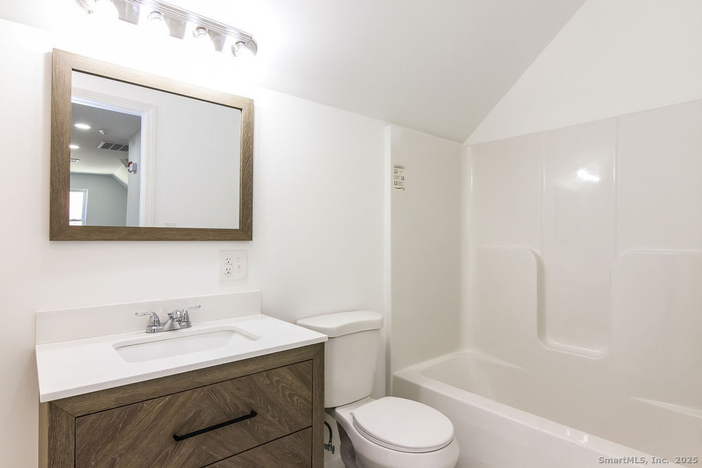 66 Winthrop Street, Unit 3 New Britain, CT 06052 - Photo 7 of 7 a bathroom with a sink a toilet and shower