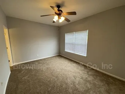 a bathroom with a sink mirror and toilet