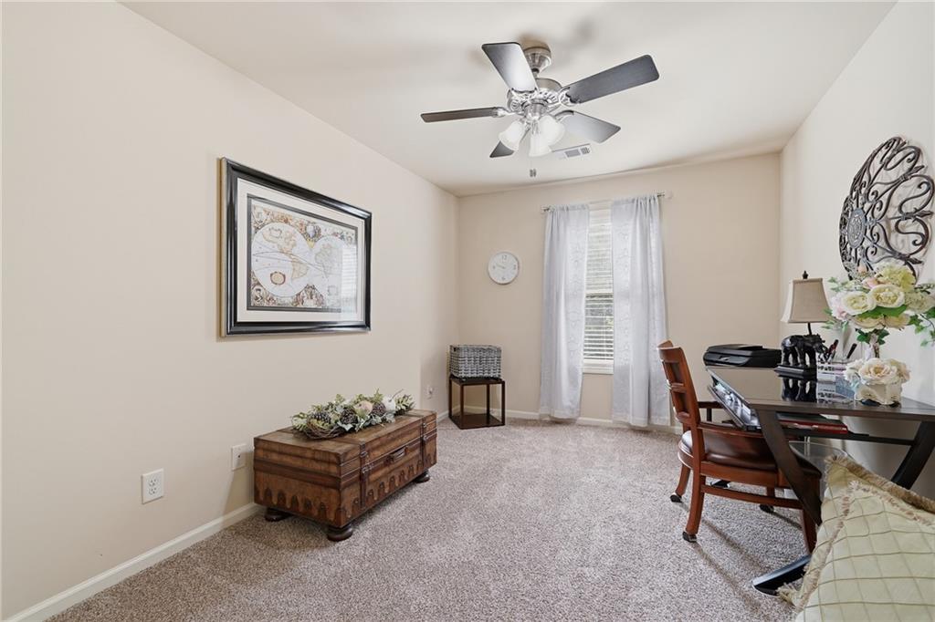 608 Myers Gate Road Ball Ground, GA 30107 - Photo 22 of 31 a living room with furniture