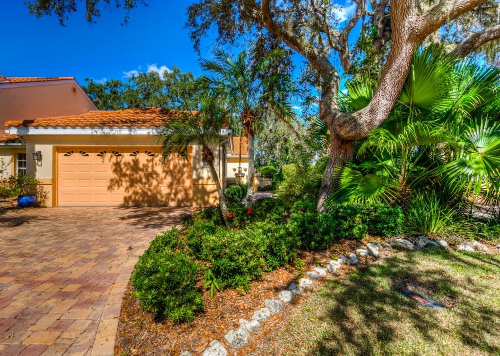 Welcome to your new home in the coveted and rarely available Blackburn Point Woods community West of the Trail in Osprey, Florida.