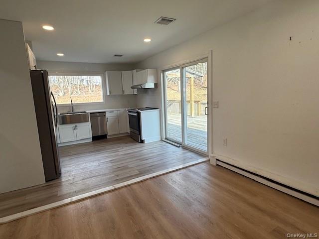 50 Continental Road Warwick, NY 10990 - Photo 29 of 46 a large kitchen with a wooden floor and a window