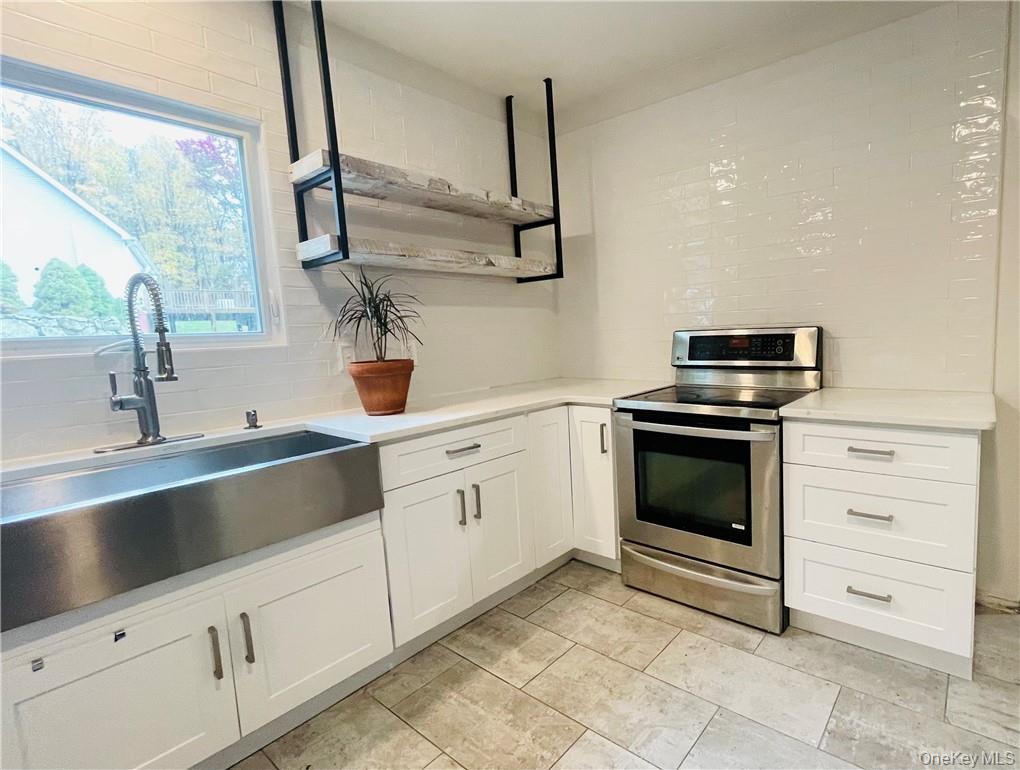 50 Continental Road Warwick, NY 10990 - Photo 3 of 46 a kitchen with cabinets appliances and a sink