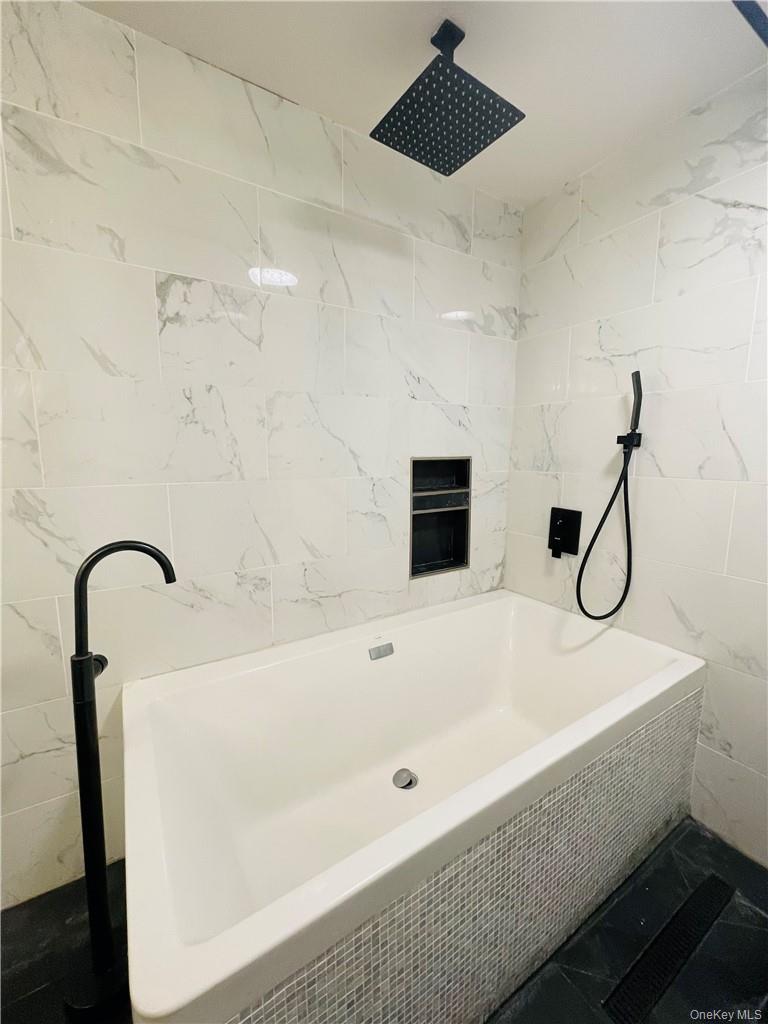 50 Continental Road Warwick, NY 10990 - Photo 10 of 46 a bathroom with a bathtub and shower