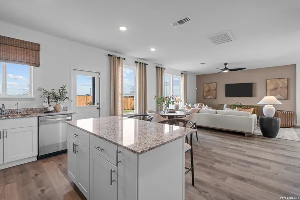 a kitchen with sink and cabinets