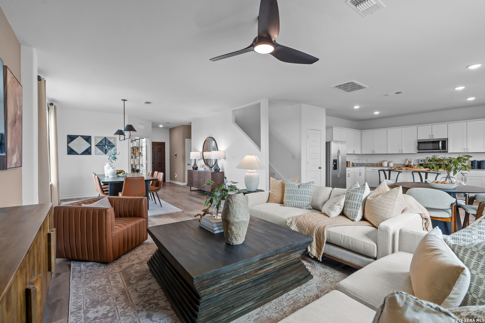 424 Raven Row Marion, TX 78124 - Photo 15 of 30 a living room with furniture kitchen view and a chandelier