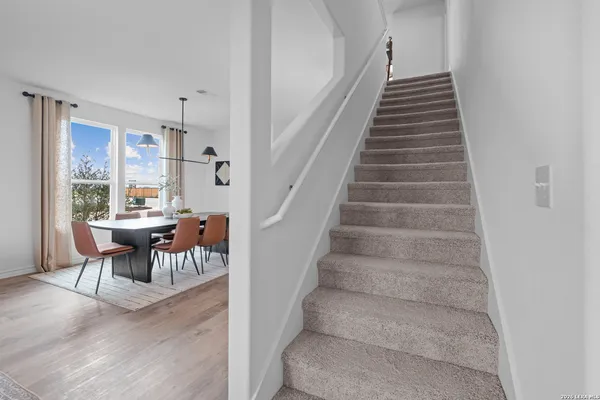 a view of entryway and hall with dining area