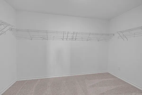 a view of a room with shelf on the wall