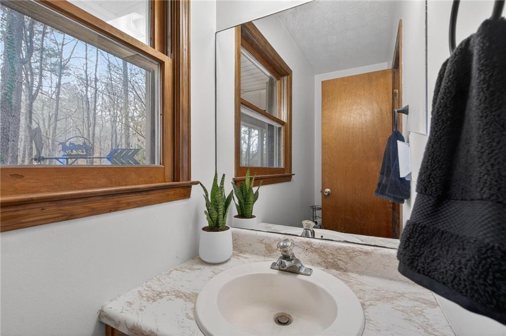 645 Davis Road Hiram, GA 30141 - Photo 14 of 30 a bathroom with a sink and a mirror