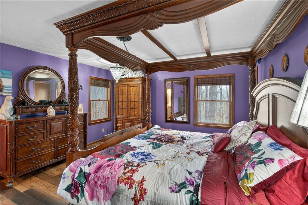 645 Davis Road Hiram, GA 30141 - Photo 17 of 30 a bedroom with a bed next to a window with dresser