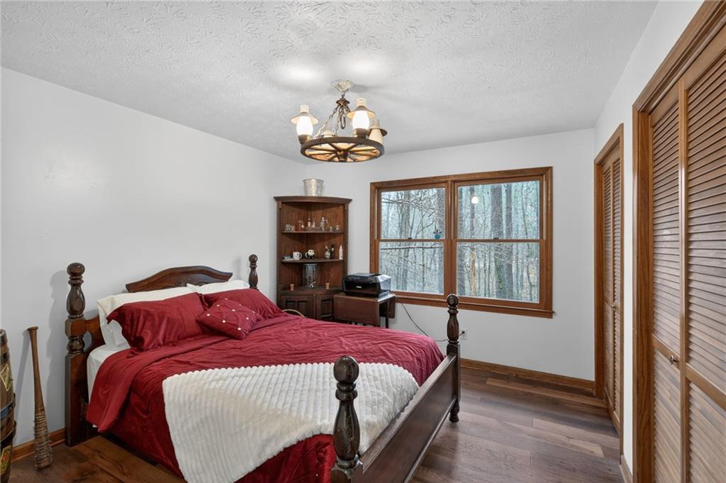 645 Davis Road Hiram, GA 30141 - Photo 19 of 30 a bedroom with a bed and a window