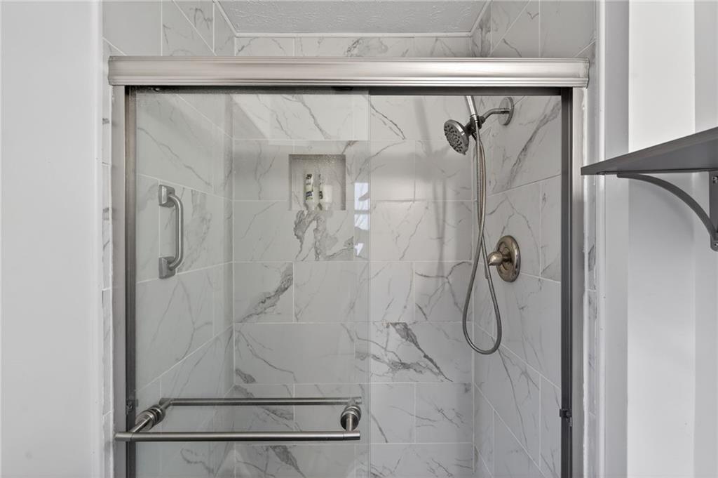 645 Davis Road Hiram, GA 30141 - Photo 24 of 30 a bathroom with a shower