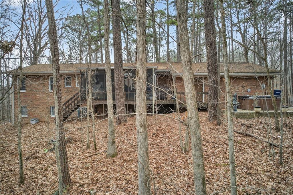 645 Davis Road Hiram, GA 30141 - Photo 28 of 30 front view of a house with a yard and an trees