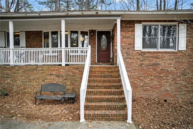 a view of a porch with furniture