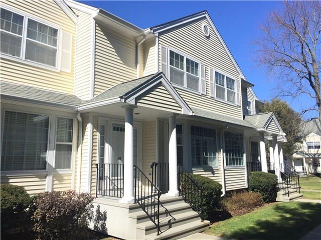180 Turn Of River Road, Unit 5B Stamford, CT 06905 - Photo 1 of 1 front view of a house with a yard