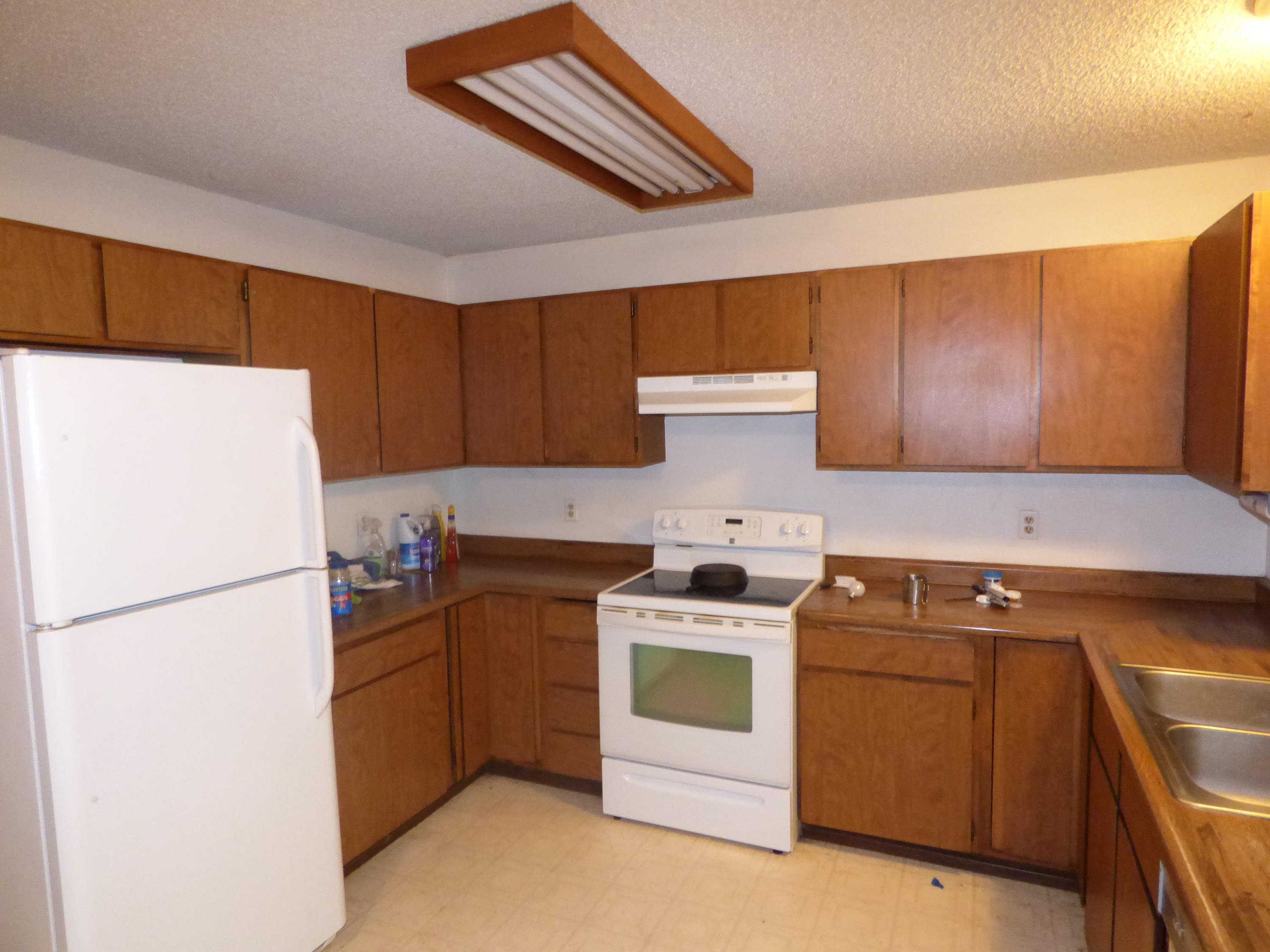 30445 Day Road McArthur, CA 96056 - Photo 13 of 25 a kitchen with a stove top oven and refrigerator