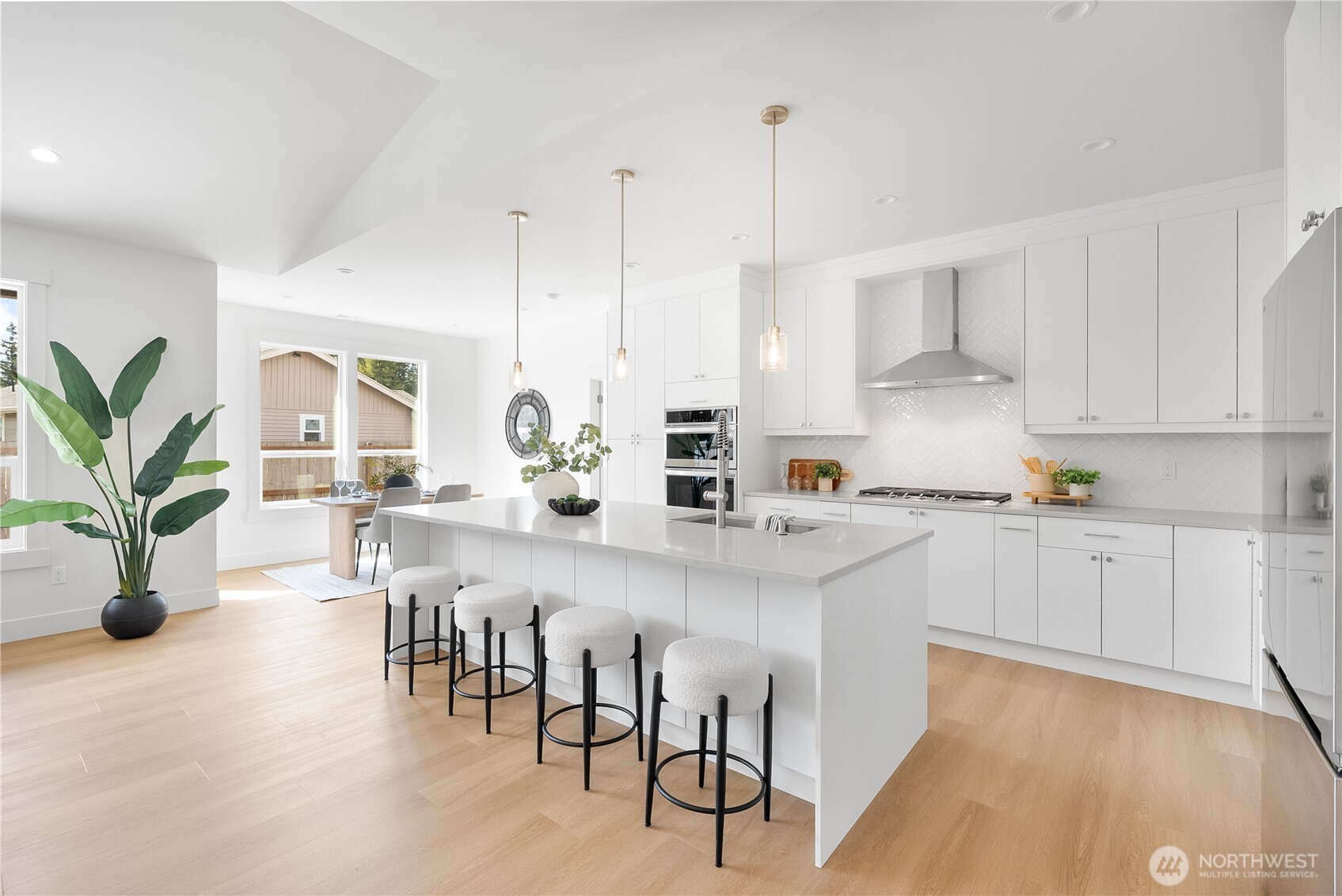 130 Sable Drive Everson, WA 98247 - Photo 12 of 40 a kitchen with white cabinets and wooden floor