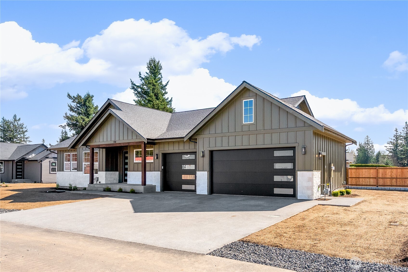 130 Sable Drive Everson, WA 98247 - Photo 2 of 40 a front view of a house with a yard and garage