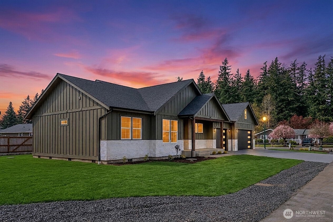 130 Sable Drive Everson, WA 98247 - Photo 3 of 40 a front view of a house with a garden and yard