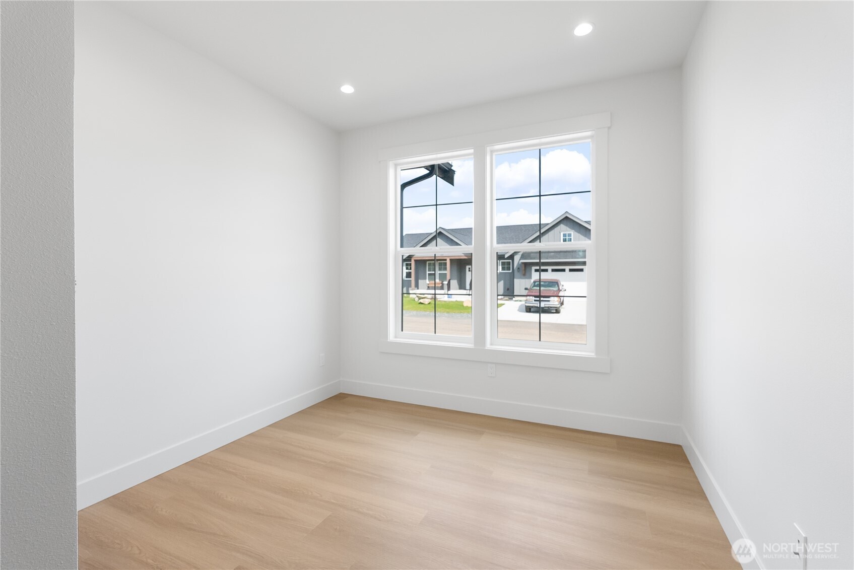 130 Sable Drive Everson, WA 98247 - Photo 31 of 40 an empty room with wooden floor and windows