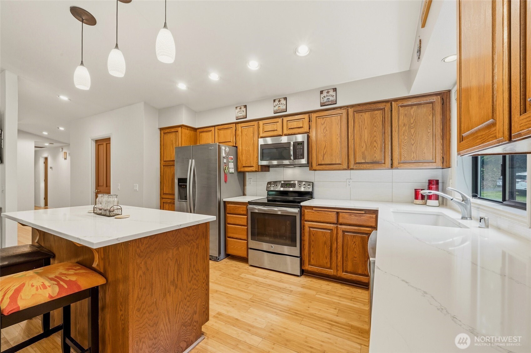 6830 Norma Beach Road Edmonds, WA 98026 - Photo 7 of 30 a kitchen with stainless steel appliances granite countertop a sink stove and refrigerator