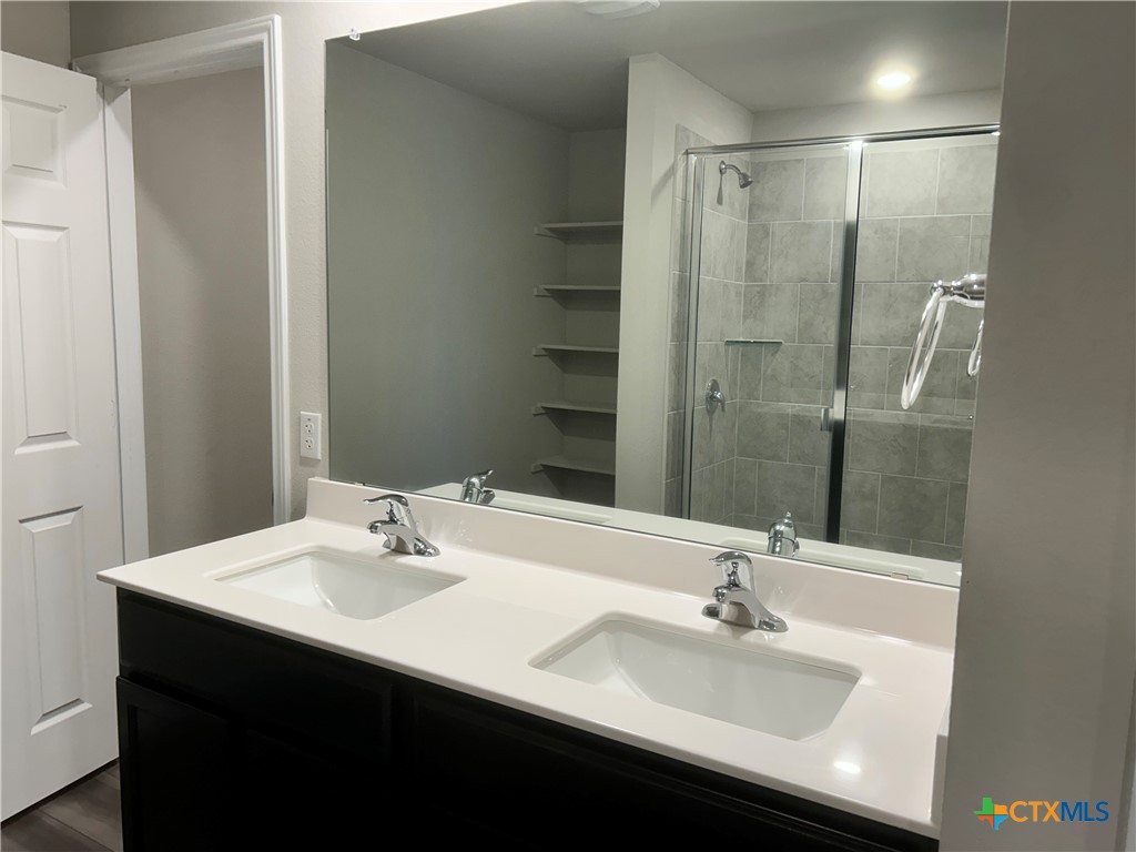 8419 Brahma Plns Road Temple, TX 76502 - Photo 11 of 17 a bathroom with a sink and a mirror