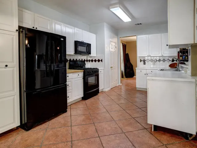 a view of cabinets a sink and dishwasher in a kitchen
