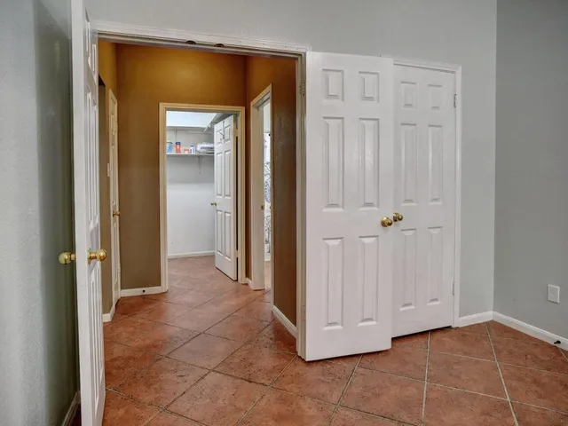 a bathroom with a sink mirror and toilet